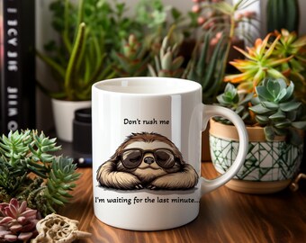 May include: White ceramic mug featuring a brown sloth wearing sunglasses with the text "Don't rush me I'm waiting for the last minute..."