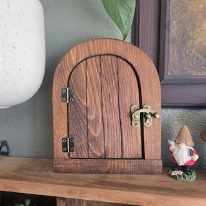 Round fairy door with opening latch