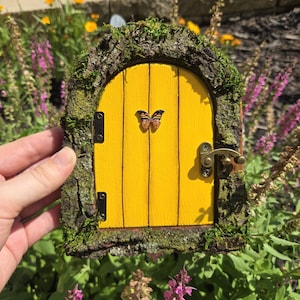 Yellow butterfly opening fairy door
