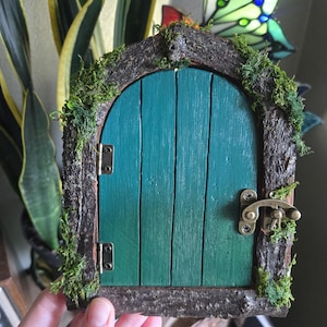 Green opening fairy door