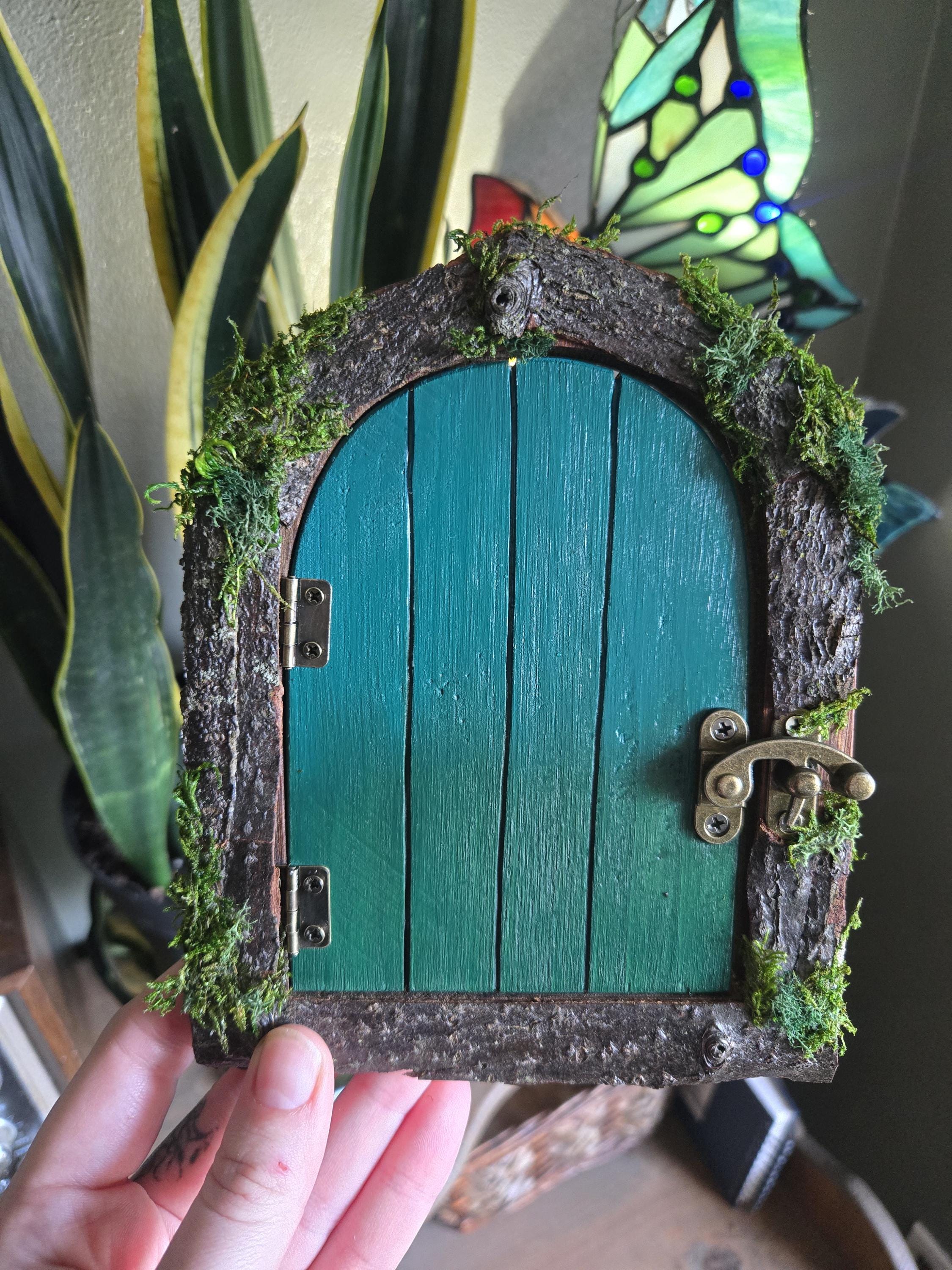 Green opening fairy door