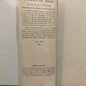 May include: A vintage book cover for "Twenty-Four Fables of &AElig;sop" by Sir Roger L'Estrange. The cover features text in black font, with quotes from the Manchester Guardian and Daily News. The book is published by Benn Books.