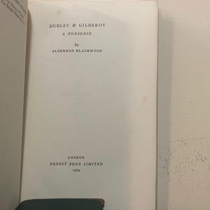 May include: Open book page with the title "DUDLEY & GILDEROY A NONSENSE" by Algernon Blackwood. Published in London by ERNEST BENN LIMITED in 1929. The book's pages are off-white, with text in black.