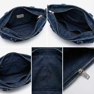 K&ouml;nnte beinhalten: Eine dunkelblaue Handtasche aus Denim mit einem Rei&szlig;verschluss oben und einem silberfarbenen Metallschieber. Das Innere ist mit dunkelblauem Stoff ausgekleidet und enth&auml;lt ein RND-Etikett sowie mehrere offene und mit Rei&szlig;verschluss versehene F&auml;cher.