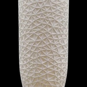 May include: A tall, off-white cylindrical vase with a geometric, textured surface. The surface is covered in a repeating pattern of triangular shapes, creating a 3D effect. The vase has a slightly tapered base and a smooth, rounded top.