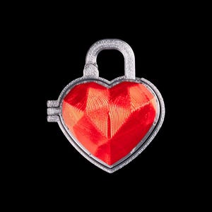 May include: A heart-shaped silver padlock with a bright red, faceted center. The padlock has a curved handle and a detailed silver frame. The background is solid black.
