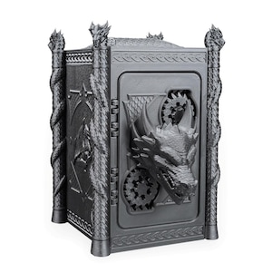 May include: A gray, 3D-printed box with intricate dragon and gear details. The box features a dragon head on the front, decorative columns, and a textured surface. The overall design is reminiscent of a fantasy theme.