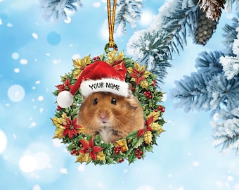 May include: A Christmas ornament featuring a hamster wearing a Santa hat and peeking out of a red and green wreath. The ornament is personalized with the text "YOUR NAME".