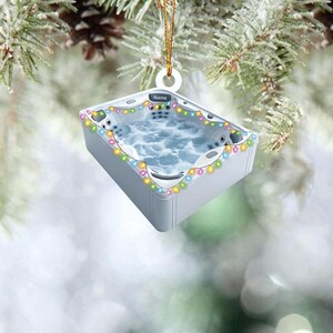 May include: White hot tub ornament with colorful lights around the edge. The ornament has the word "Name" on it.