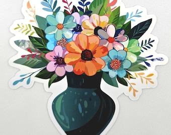 May include: A die-cut sticker featuring a dark teal vase filled with a vibrant bouquet of flowers in shades of orange, light blue, pink, and yellow, accented by various green leaves and stems, all set against a clean white background.