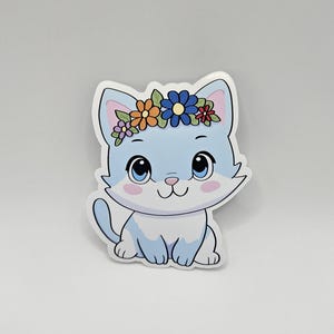 Naklejka na głowę z uroczym kotem i kwiatową koroną | Naklejka winylowa Kawaii Kitten Floral Headband | Naklejka winylowa odporna na warunki atmosferyczne