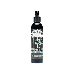 May include: A black spray bottle with a white label that says "REVIVE & REVEL" and "HYDRO-HATER SPRAY WATER-PROOFING SPRAY SAFE ON ALL OUTDOOR GEAR".