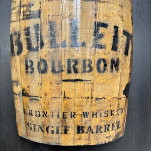 Barrel wall hanging with Bulleit bourbon labeled.