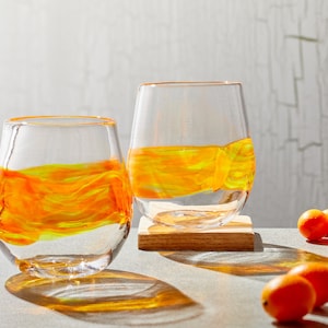 Stemless wine glasses with orange/yellow band. Hand blown barware, cocktail glassware. Handmade drinking glasses made in USA.