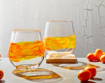 Stemless wine glasses with orange/yellow band. Hand blown barware, cocktail glassware. Handmade drinking glasses made in USA.