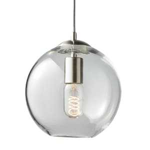 May include: Clear glass pendant light with a round, bubble-like shape. The light fixture has a silver-colored metal base and a visible, spiral-shaped light bulb. The light hangs from a thin, gray cord.