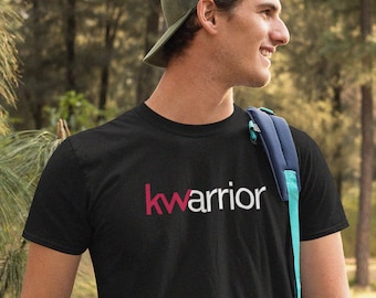 May include: A black t-shirt with a white graphic that says "kwarrior" in white letters with a pink "k".