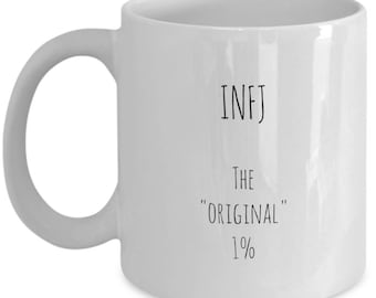 May include: White ceramic coffee mug with black text that reads "INFJ The "Original" 1%"