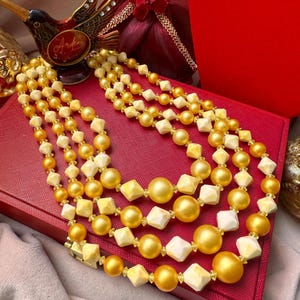 vintage Hong Kong yellow four strand beaded necklace