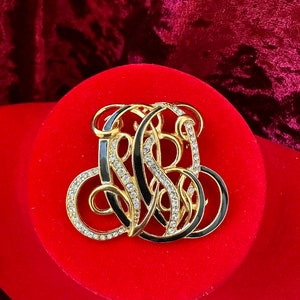 vintage trifari monogram brooch pin gold tone rhinestone and black enamel