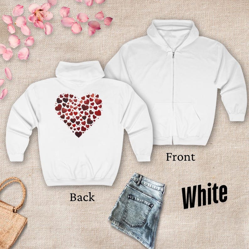 May include: White zippered hoodie with a heart made of smaller hearts on the back. The front of the hoodie is blank.