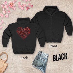 May include: Black zippered hoodie with a large red heart made of smaller hearts on the back. The front of the hoodie is plain black.