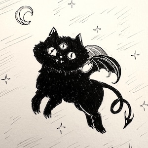 May include: A black cat illustration with three eyes, bat wings, and a curled tail. The cat is depicted in a night sky with a crescent moon and stars. The artwork is signed by the artist.