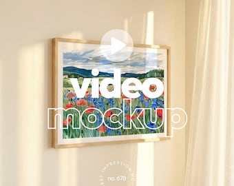 May include: A framed watercolor print featuring a vibrant field of red and blue flowers under a cloudy sky. The artwork is displayed on a beige wall, with the words "video mockup" overlaid on the image.
