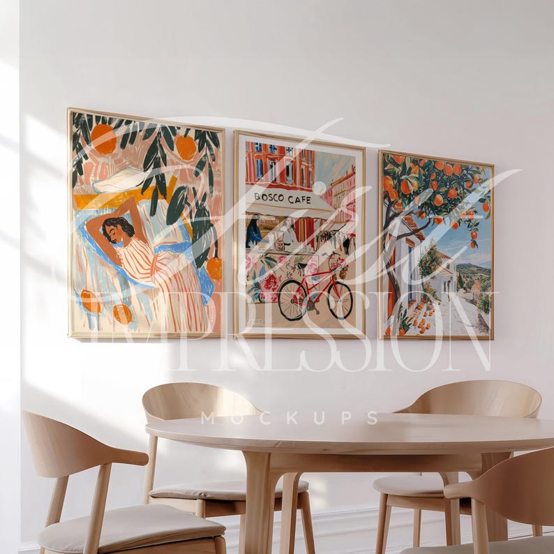 May include: Three framed art prints with a white background. The left print features a woman laying down with orange trees in the background. The middle print features a cafe with the text "Bosco Cafe" and a bicycle in the foreground. The right print features a street scene with orange trees and a white building.