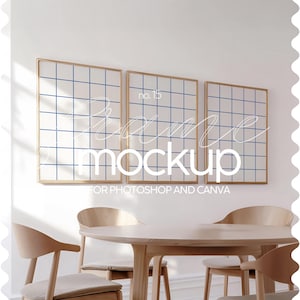 May include: Three gold framed pictures with a blue grid pattern on a white wall in a room with a wooden table and chairs. The text "Frame Mockup for Photoshop and Canva" is below the pictures.