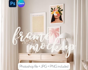 May include: A light wood desk with two drawers and a white lamp on the left side. There are three framed prints on the wall behind the desk. The prints are of a woman with flowers covering her face, a palm tree, and a poster with the text "WILLIAM MORRIS".