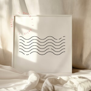 May include: A white framed print with a black and white graphic of wavy lines. The text "RATIO 1:1" is repeated around the edge of the print.