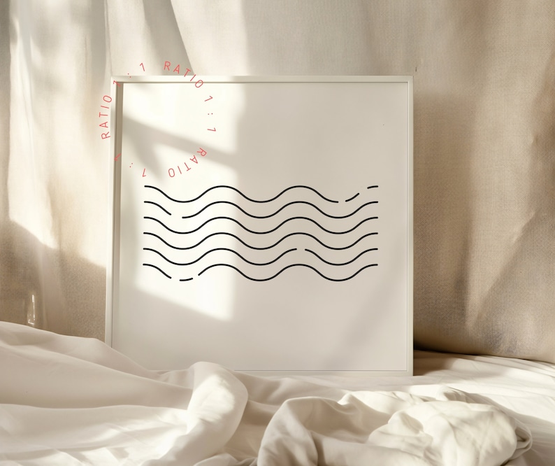 May include: A white framed print with a black and white graphic of wavy lines. The text "RATIO 1:1" is repeated around the edge of the print.