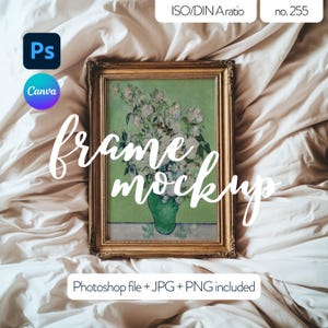 May include: A gold-framed picture mockup with a painting of white flowers in a green vase on a white bed sheet. The text "frame mockup" is written in cursive on the image.