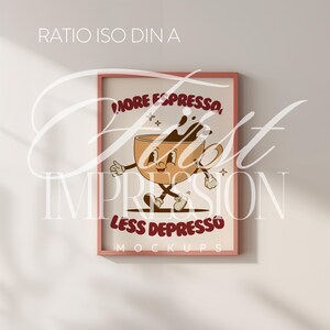 May include: A pink framed poster with a cartoon illustration of a coffee cup with a smiling face. The text on the poster reads "More Espresso, Less Depresso".