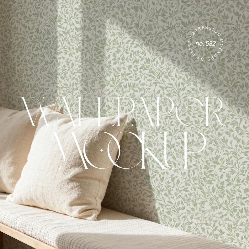 May include: A mockup featuring a light green wallpaper with a delicate leaf pattern. Two cream-colored pillows rest on a wooden bench. The words "Wallpaper Mockup" are displayed in a stylized font.