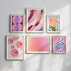 May include: A set of six framed prints with abstract and illustrative designs. The prints feature pink, blue, and white colors and include a cat, a flower, and geometric shapes.