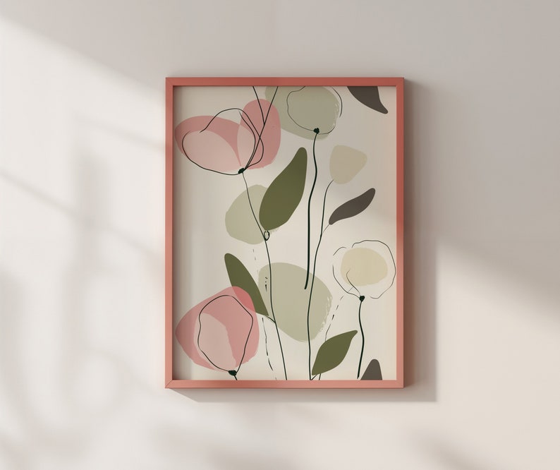 Puede incluir: Una impresi&oacute;n de arte abstracto enmarcada con formas florales rosas y verdes sobre un fondo crema. El marco es de color rosa claro.