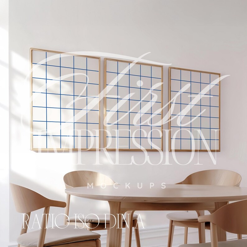 May include: Three framed grid pattern prints with a blue and white design hang on a white wall above a wooden table with four chairs. The text "First Impression Mockups" is printed below the frames.
