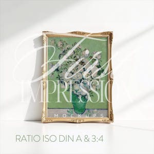 May include: A framed painting of a vase of white flowers with a green background. The frame is gold and has a decorative design. The text "RATIO ISO DIN A & 3:4" is printed below the frame.