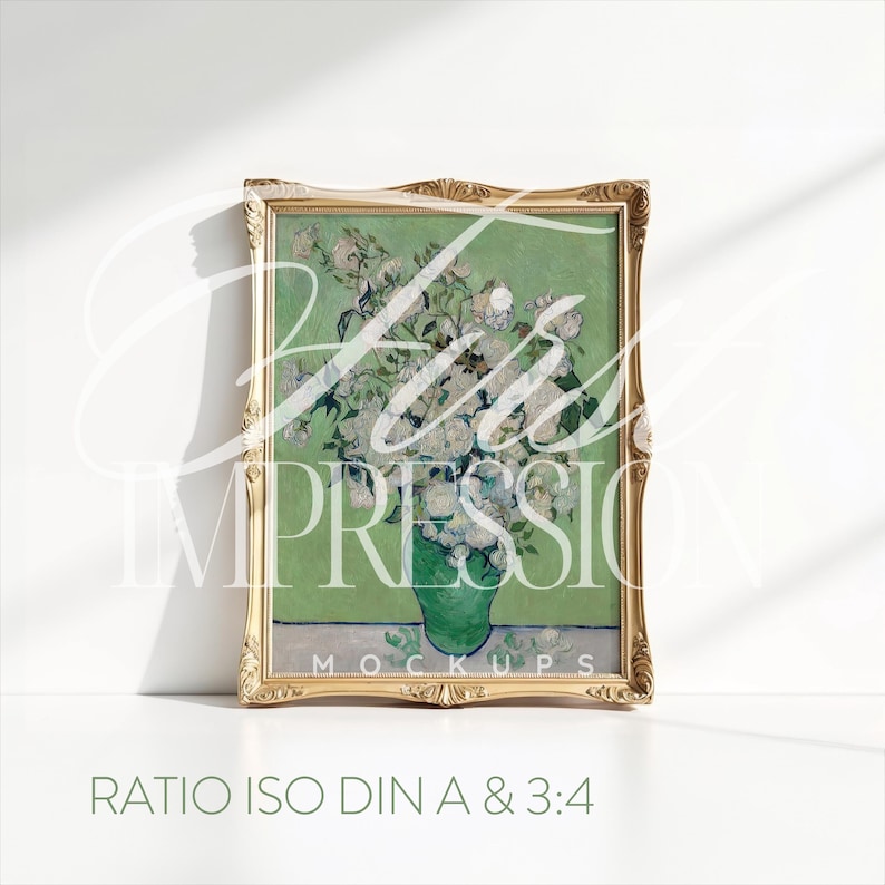 May include: A framed painting of a vase of white flowers with a green background. The frame is gold and has a decorative design. The text "RATIO ISO DIN A & 3:4" is printed below the frame.