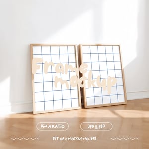 May include: Two wooden picture frames with a grid pattern on the white matting. The frames are on a light wood floor. The text "Frame Mockup" is written in a light brown color on the frames.