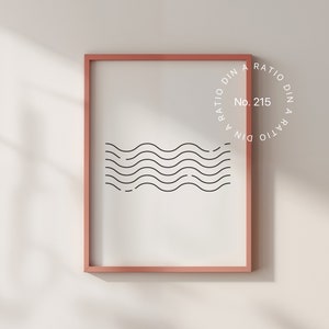 Puede incluir: Una impresi&oacute;n enmarcada con un dise&ntilde;o minimalista de l&iacute;neas onduladas en negro sobre fondo blanco. El marco es de color rosa claro. La impresi&oacute;n tiene el texto "A RATIO DIN A RATIO DIN No. 215" en un c&iacute;rculo.