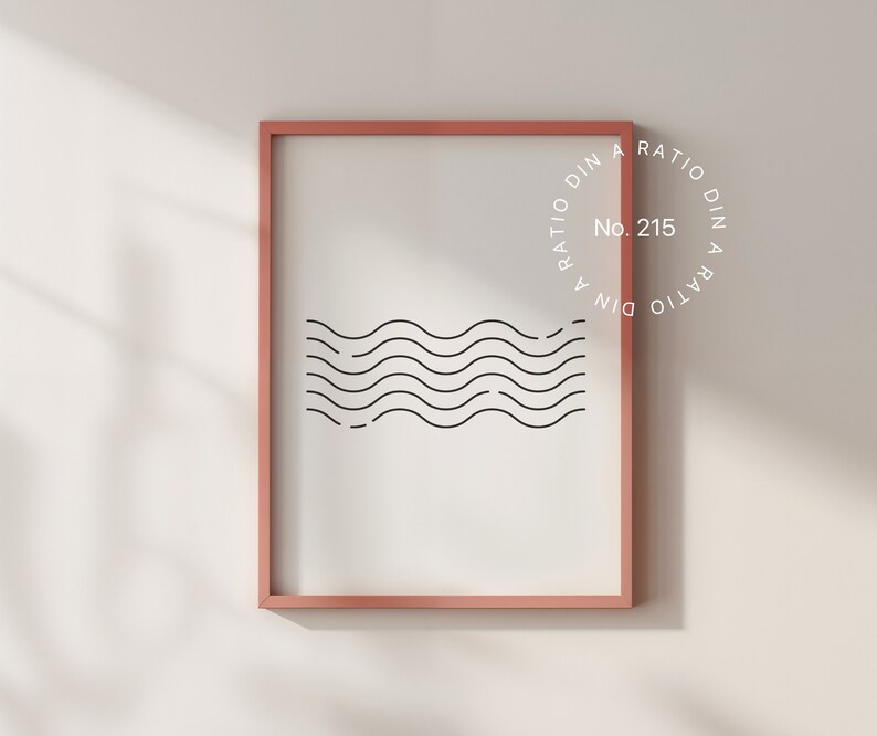 Puede incluir: Una impresi&oacute;n enmarcada con un dise&ntilde;o minimalista de l&iacute;neas onduladas en negro sobre fondo blanco. El marco es de color rosa claro. La impresi&oacute;n tiene el texto "A RATIO DIN A RATIO DIN No. 215" en un c&iacute;rculo.