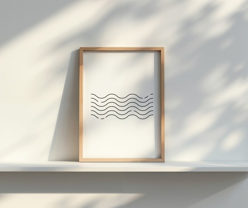 May include: A framed print with a minimalist design of black wavy lines on a white background. The frame is made of light brown wood.