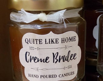 Creme Brulee scented 4 oz. jar candle with gold lid, and organza ribbon. Dessert, caramel, sweet, sugar, sugary, rich, spices, vanilla