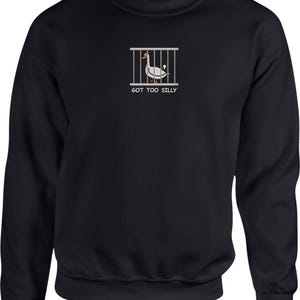 May include: Black sweatshirt with a white goose in a cage graphic and the text "GOT TOO SILLY".