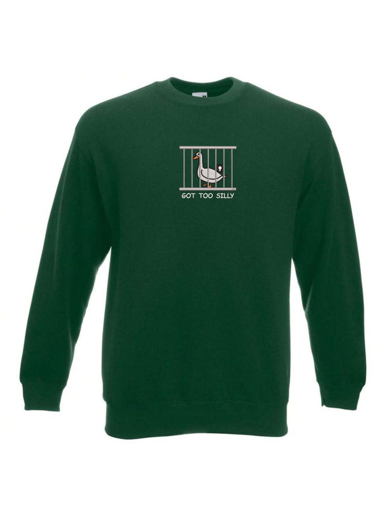 May include: A dark green sweatshirt with a white graphic of a goose in a cage. The text "GOT TOO SILLY" is printed below the graphic.