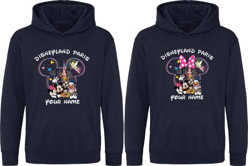 May include: Navy blue hooded sweatshirts with a Disneyland Paris graphic. The design features Mickey and Minnie Mouse, Donald Duck, and other characters. The text "YOUR NAME" is below the graphic.