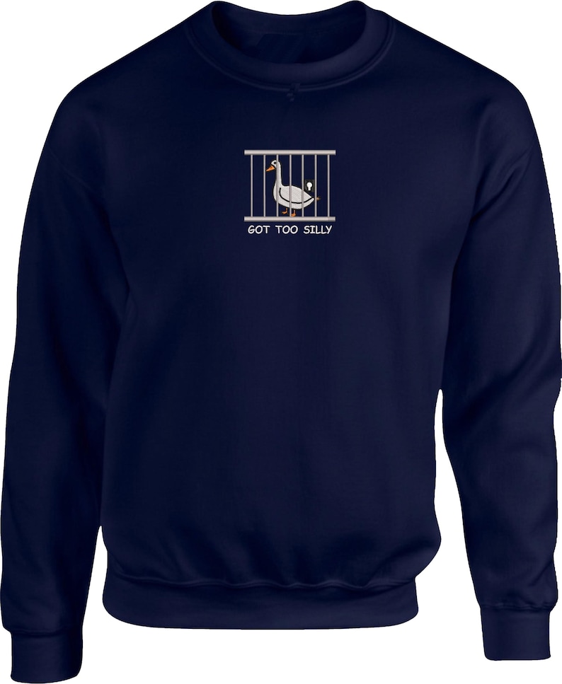 May include: A navy blue sweatshirt with a white graphic of a duck in a cage and the text "GOT TOO SILLY".